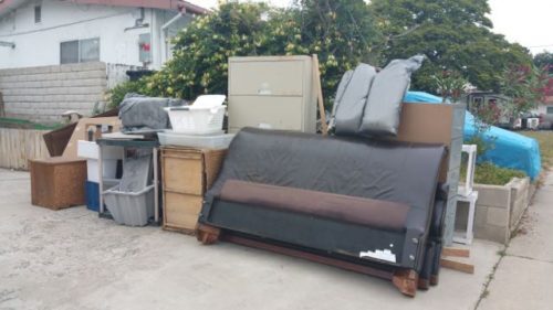 Curbside pile of furniture ready for haul-away