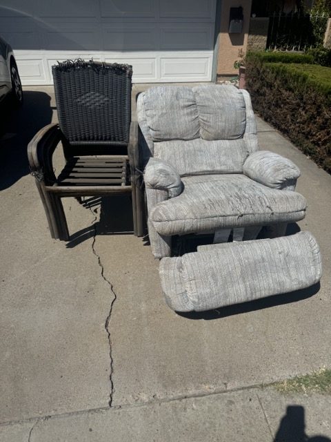 Recliner and patio chair staged in a driveway