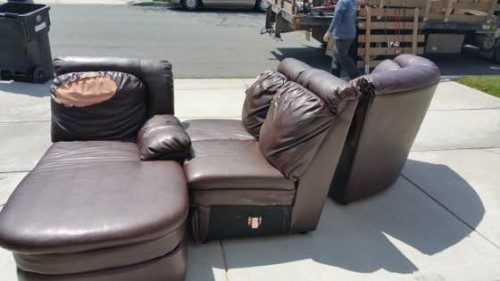 Three-piece leather sectional staged at the curb